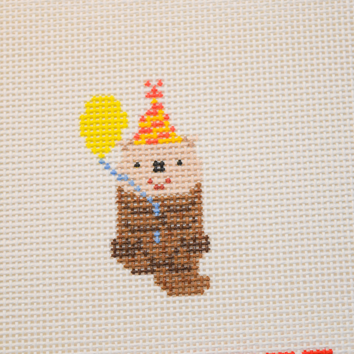 Party Otter needlepoint canvas from La Fête Needlepoint’s Party Animals collection